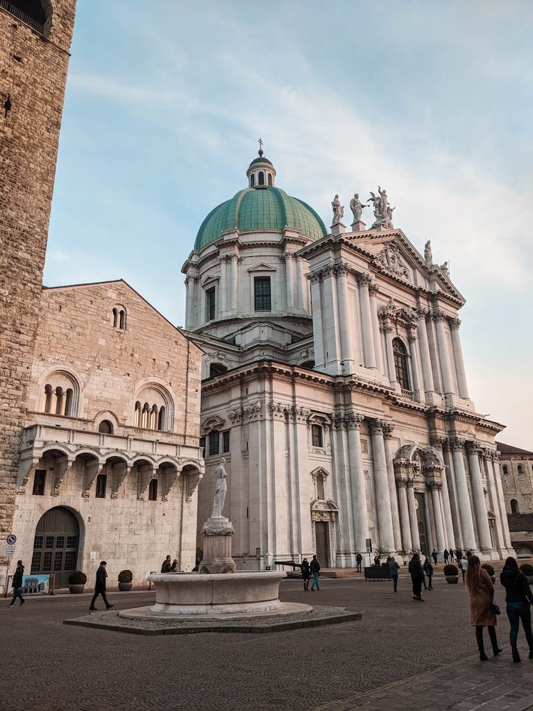 Captivating view of Brescia's cathedral with a striking dome in a serene setting.